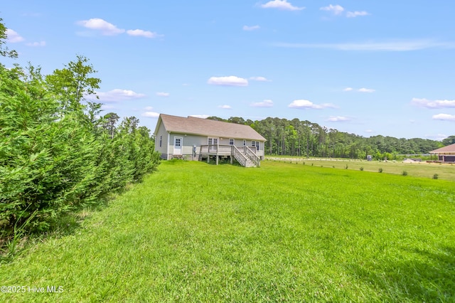 1406 Silverbrook Rd, Oriental, NC 28571 - view of grassy yard featuring stairs and a wooden deck