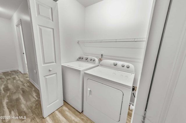 1406 Silverbrook Rd, Oriental, NC 28571 - laundry room featuring washing machine and clothes dryer and light wood-style floors