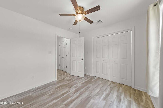 1406 Silverbrook Rd, Oriental, NC 28571 - unfurnished bedroom featuring wood finished floors, a closet, baseboards, and a ceiling fan