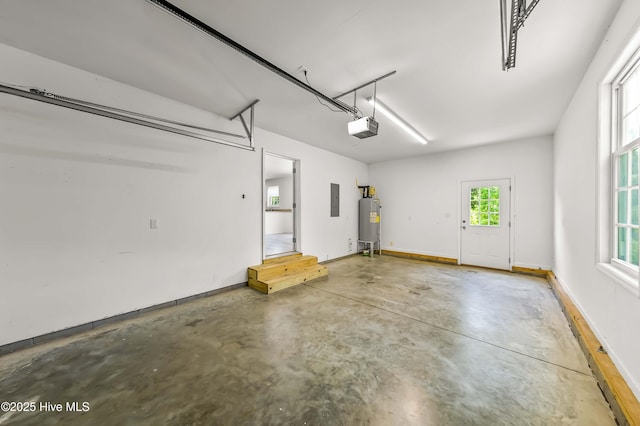 1406 Silverbrook Rd, Oriental, NC 28571 - garage with a garage door opener, electric water heater, electric panel, and baseboards