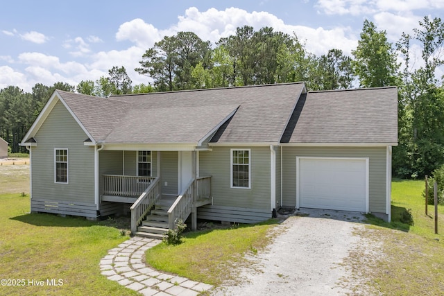 1406 Silverbrook Rd, Oriental, NC 28571 - view of front of house with an attached garage, covered porch, a shingled roof, a front lawn, and gravel driveway