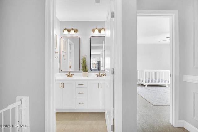 full bath featuring double vanity and a sink