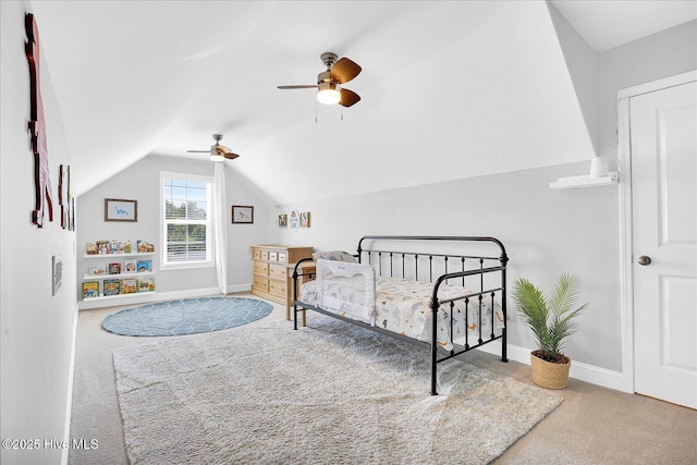 bedroom with baseboards, carpet flooring, a ceiling fan, and vaulted ceiling