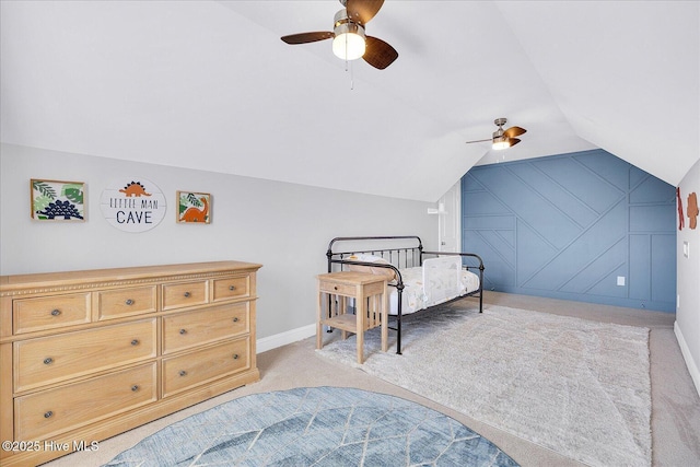 bedroom featuring light colored carpet, baseboards, lofted ceiling, and ceiling fan