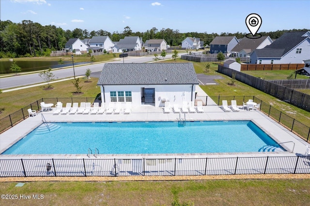 pool featuring a patio and fence