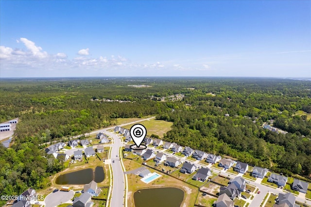 birds eye view of property with a forest view and a residential view