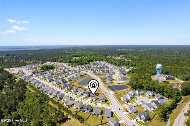 aerial view featuring a residential view and a view of trees