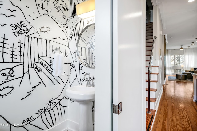 interior space featuring wood finished floors and baseboards