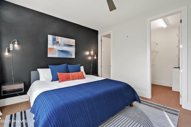 bedroom featuring carpet floors, ceiling fan, and baseboards