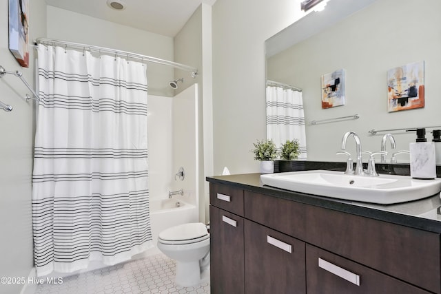 bathroom featuring shower / tub combo, vanity, and toilet