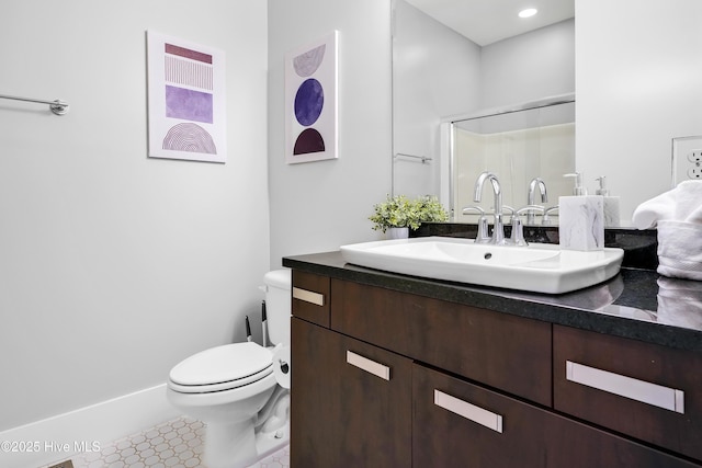 bathroom with toilet and vanity