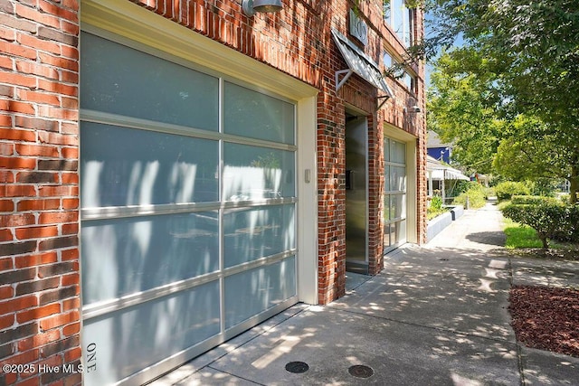 view of property exterior featuring brick siding