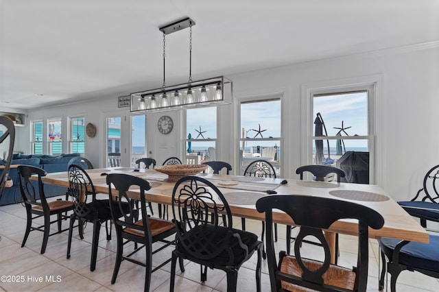 826 Fort Fisher Blvd N, Kure Beach, NC 28449 - dining area with light tile patterned floors and crown molding