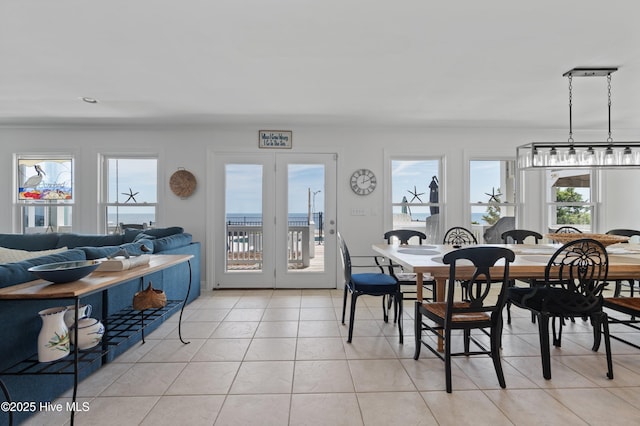 826 Fort Fisher Blvd N, Kure Beach, NC 28449 - dining area featuring healthy amount of natural light, light tile patterned floors, and french doors