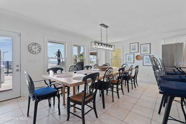 826 Fort Fisher Blvd N, Kure Beach, NC 28449 - dining room with light tile patterned floors and baseboards