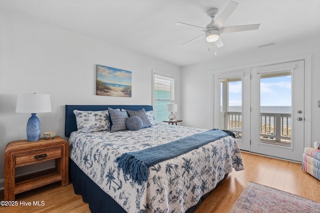 826 Fort Fisher Blvd N, Kure Beach, NC 28449 - bedroom with access to exterior, light wood-style flooring, and a ceiling fan
