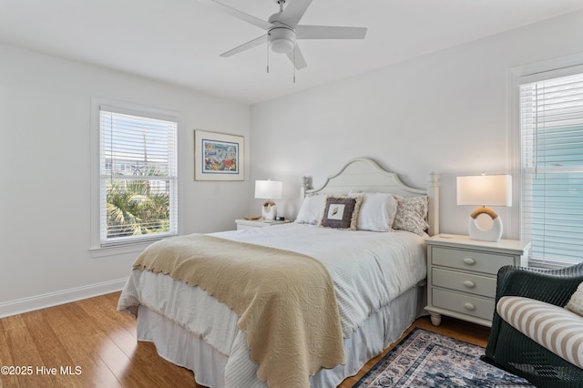 826 Fort Fisher Blvd N, Kure Beach, NC 28449 - bedroom featuring wood finished floors, baseboards, and a ceiling fan