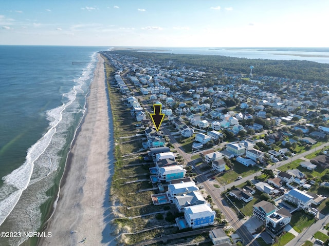 aerial view featuring a view of the beach and a water view