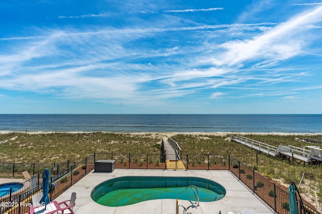 826 Fort Fisher Blvd N, Kure Beach, NC 28449 - community pool with view of water and beach and a patio area