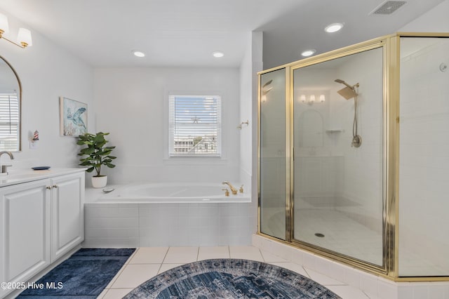 826 Fort Fisher Blvd N, Kure Beach, NC 28449 - bathroom featuring tile patterned floors, a stall shower, a bath, vanity, and recessed lighting
