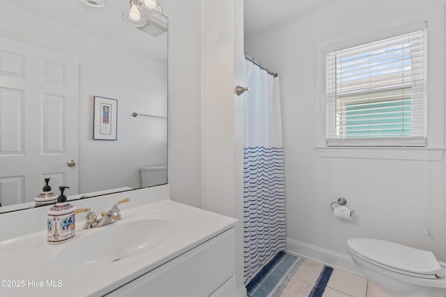 826 Fort Fisher Blvd N, Kure Beach, NC 28449 - full bathroom featuring toilet, vanity, tile patterned floors, and baseboards