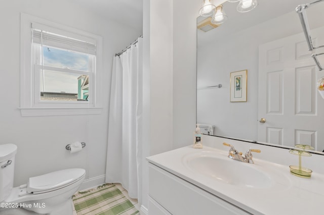 826 Fort Fisher Blvd N, Kure Beach, NC 28449 - full bathroom featuring toilet, vanity, and baseboards