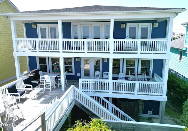 826 Fort Fisher Blvd N, Kure Beach, NC 28449 - rear view of house featuring stairway and a shingled roof