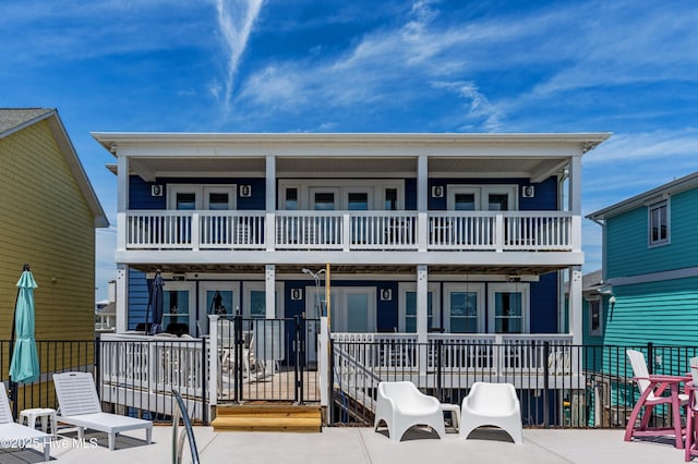 826 Fort Fisher Blvd N, Kure Beach, NC 28449 - view of front facade featuring a balcony and covered porch
