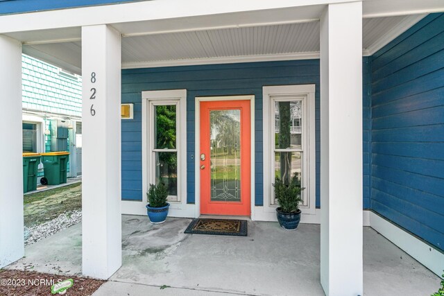 826 Fort Fisher Blvd N, Kure Beach, NC 28449 - entrance to property featuring covered porch