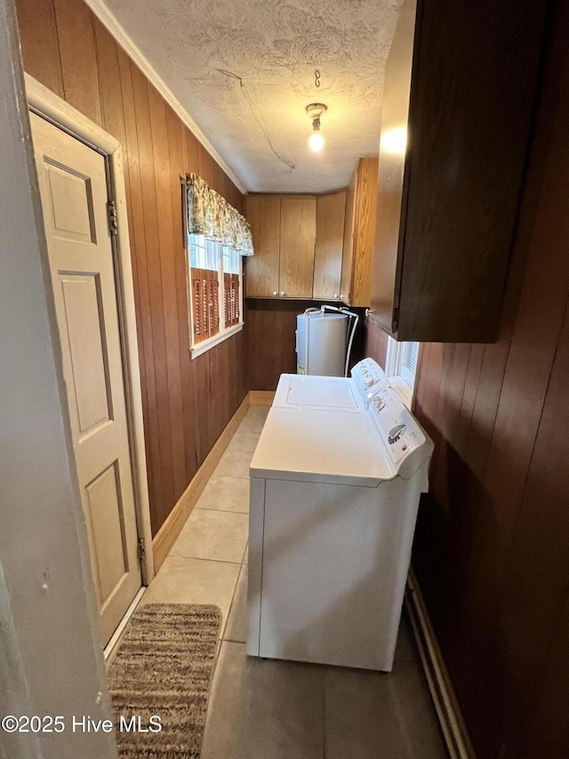 214 S Graham St, Wallace, NC 28466 - washroom with cabinet space, washer and clothes dryer, wood walls, a textured ceiling, and crown molding