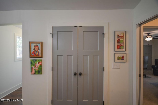 corridor featuring baseboards