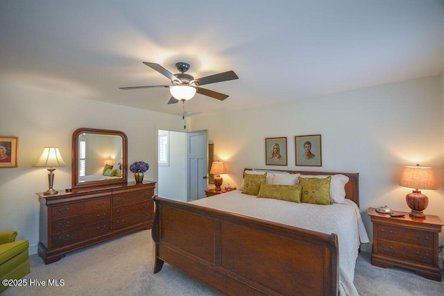 bedroom with light colored carpet and ceiling fan