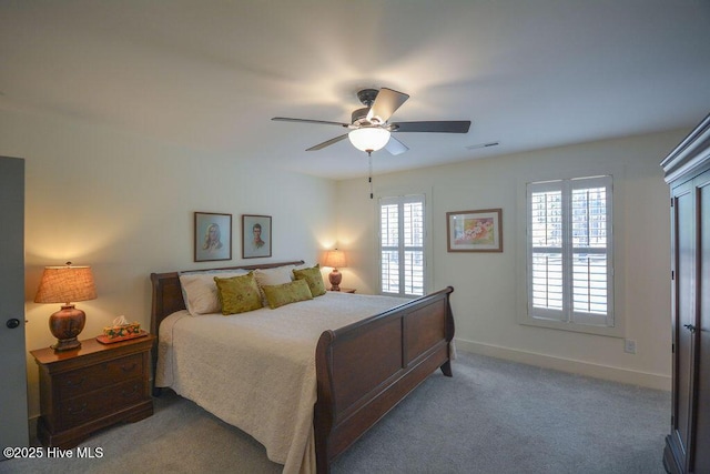 bedroom featuring visible vents, baseboards, ceiling fan, and carpet floors