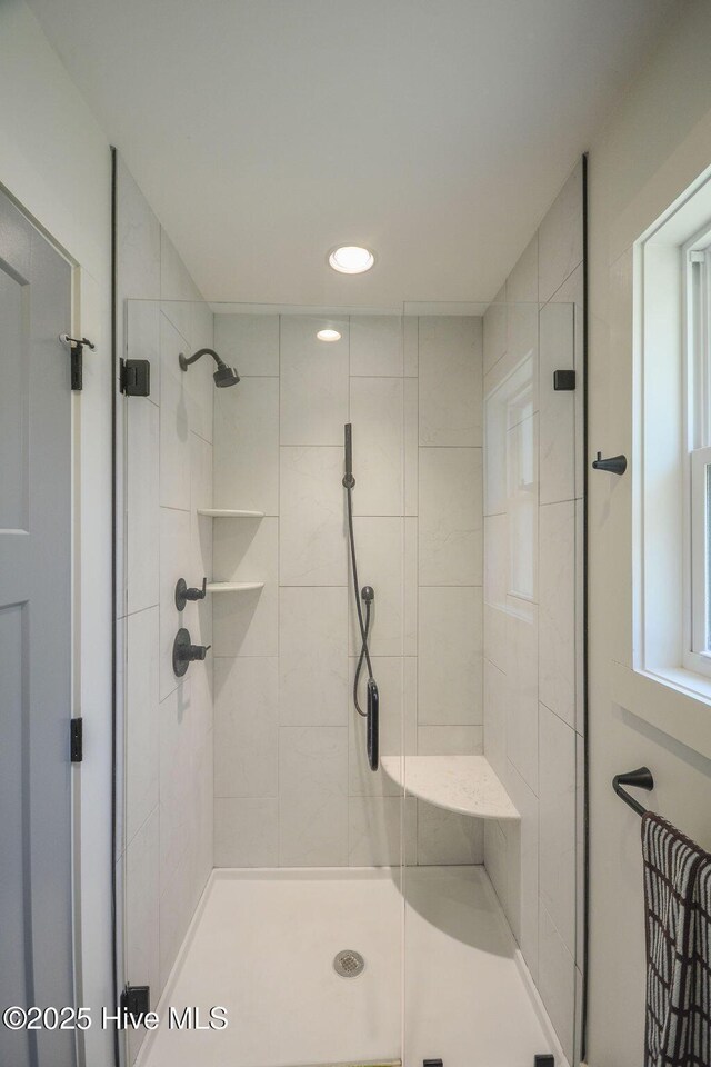 full bathroom featuring a stall shower and recessed lighting