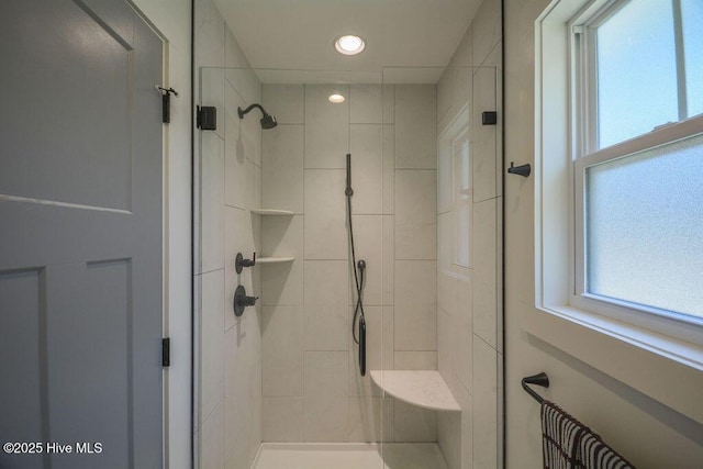 bathroom featuring a stall shower and recessed lighting