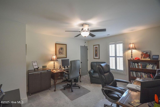 office featuring visible vents, ceiling fan, and carpet