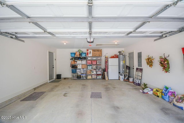garage with freestanding refrigerator, water heater, and electric panel