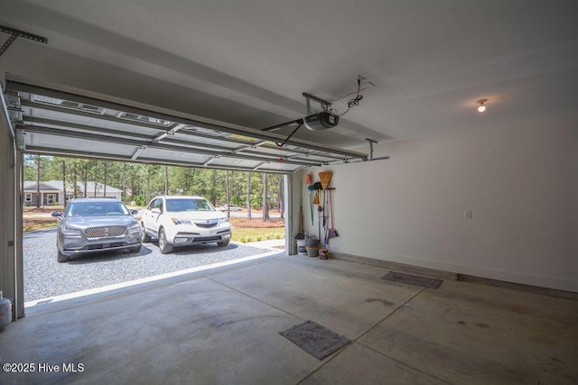 garage featuring baseboards and a garage door opener