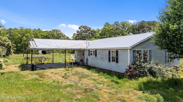1770 Old Washington Rd, Vanceboro, NC 28586 - back of house with a carport and metal roof