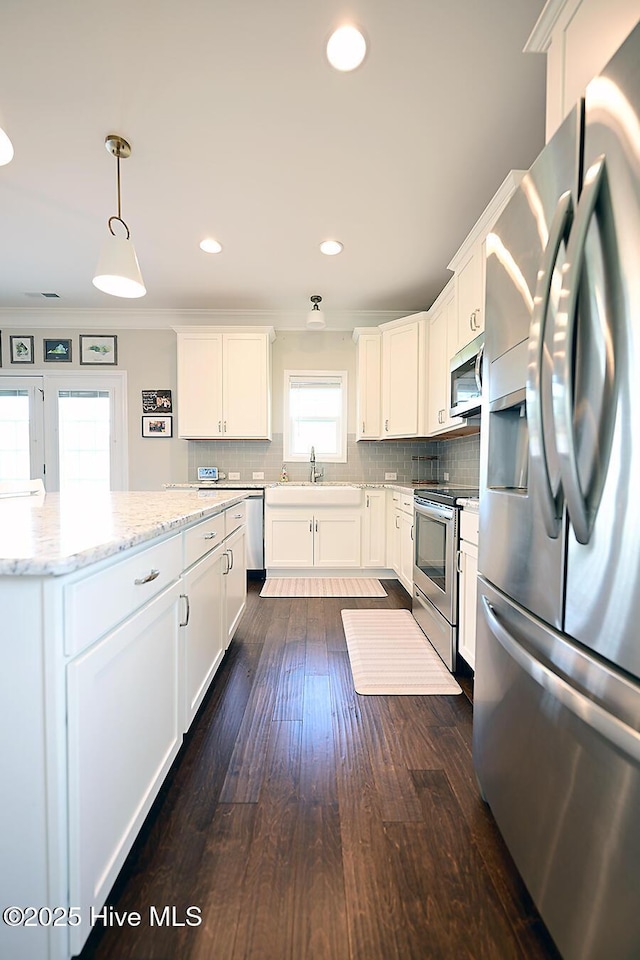 911 Needlerush Rd, Sneads Ferry, NC 28460 - kitchen featuring stainless steel appliances, a sink, white cabinetry, and recessed lighting