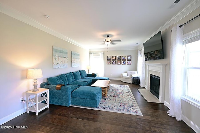 911 Needlerush Rd, Sneads Ferry, NC 28460 - living room featuring a ceiling fan, plenty of natural light, a fireplace with flush hearth, baseboards, and crown molding