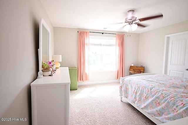 911 Needlerush Rd, Sneads Ferry, NC 28460 - bedroom featuring carpet, baseboards, and ceiling fan