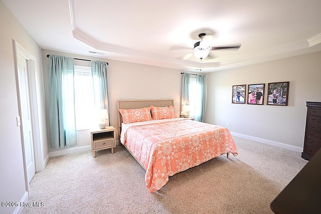 911 Needlerush Rd, Sneads Ferry, NC 28460 - bedroom featuring a tray ceiling, carpet flooring, crown molding, and baseboards
