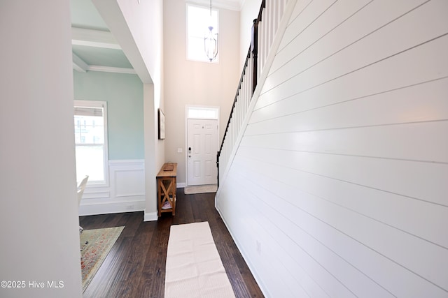 911 Needlerush Rd, Sneads Ferry, NC 28460 - corridor with dark wood-style floors, a wainscoted wall, stairway, crown molding, and a high ceiling