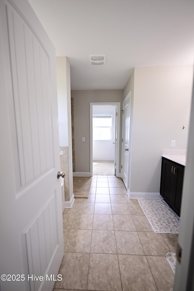 911 Needlerush Rd, Sneads Ferry, NC 28460 - corridor with light tile patterned flooring and baseboards