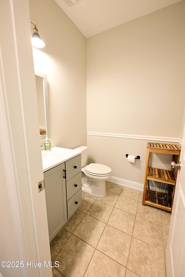 911 Needlerush Rd, Sneads Ferry, NC 28460 - half bathroom with vanity, toilet, and tile patterned floors