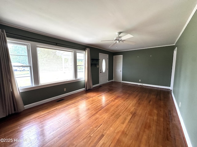 706 E Country Club Dr, Tarboro, NC 27886 - unfurnished room with wood finished floors, visible vents, baseboards, ceiling fan, and ornamental molding