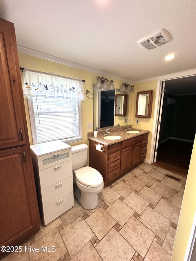 706 E Country Club Dr, Tarboro, NC 27886 - bathroom with double vanity, visible vents, and a sink