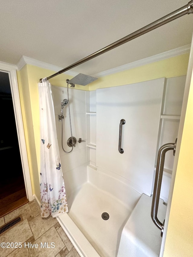 706 E Country Club Dr, Tarboro, NC 27886 - full bathroom featuring a stall shower, crown molding, baseboards, and visible vents