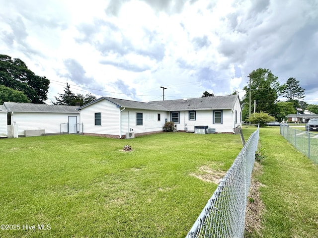 706 E Country Club Dr, Tarboro, NC 27886 - back of house with a fenced backyard, central AC, and a lawn